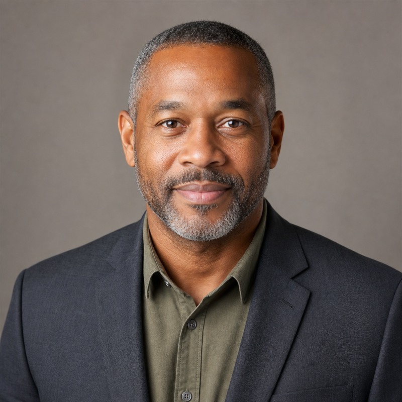 Professional headshot of Marcus Reed